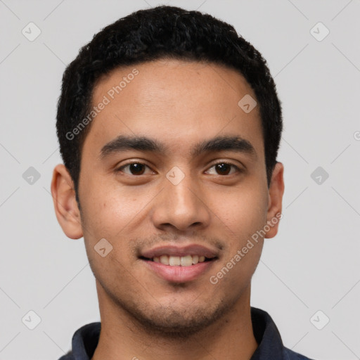 Joyful latino young-adult male with short  black hair and brown eyes