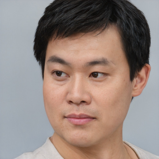 Neutral asian young-adult male with short  black hair and brown eyes