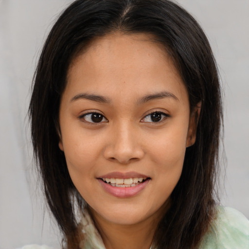 Joyful white young-adult female with medium  brown hair and brown eyes