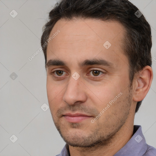 Joyful white adult male with short  brown hair and brown eyes