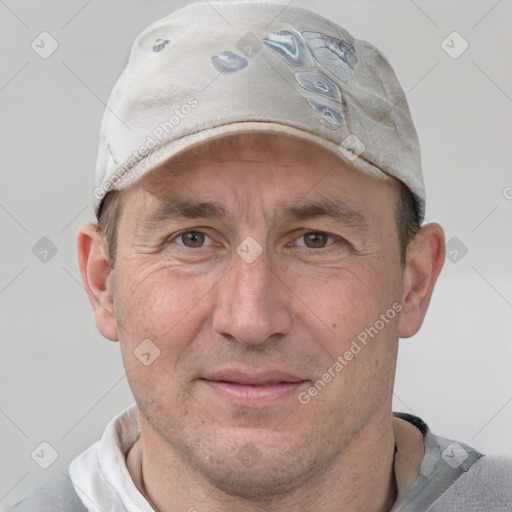 Joyful white adult male with short  brown hair and grey eyes