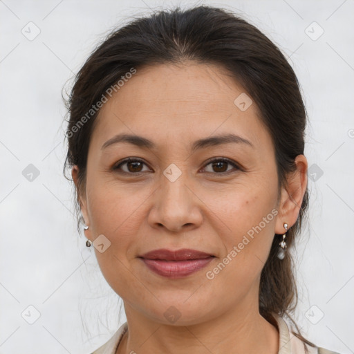 Joyful white adult female with medium  brown hair and brown eyes