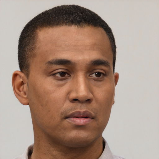 Neutral latino young-adult male with short  brown hair and brown eyes