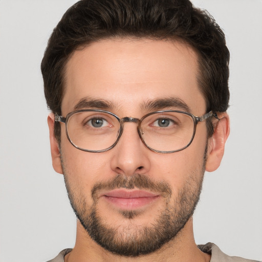 Joyful white young-adult male with short  brown hair and brown eyes