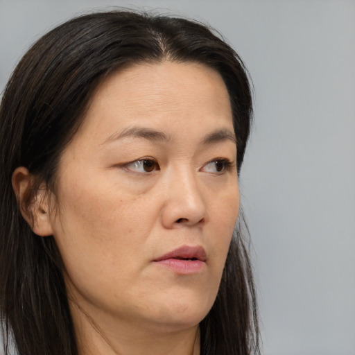 Neutral asian young-adult female with long  brown hair and brown eyes