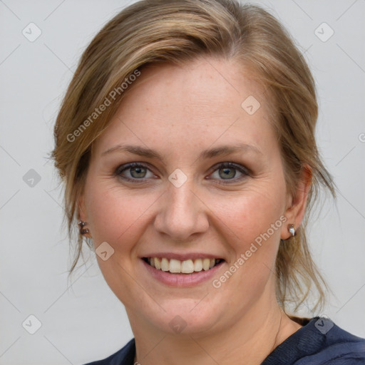 Joyful white young-adult female with medium  brown hair and blue eyes