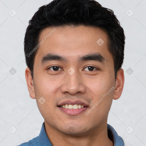 Joyful latino young-adult male with short  black hair and brown eyes