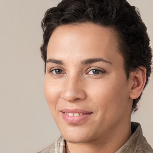 Joyful white young-adult female with short  brown hair and brown eyes