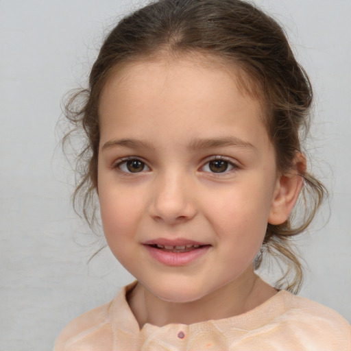 Joyful white child female with medium  brown hair and brown eyes