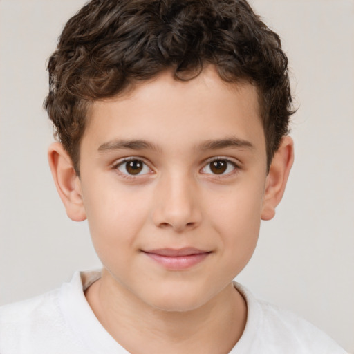 Joyful white child male with short  brown hair and brown eyes