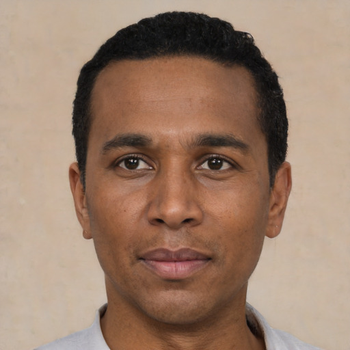 Neutral latino adult male with short  black hair and brown eyes
