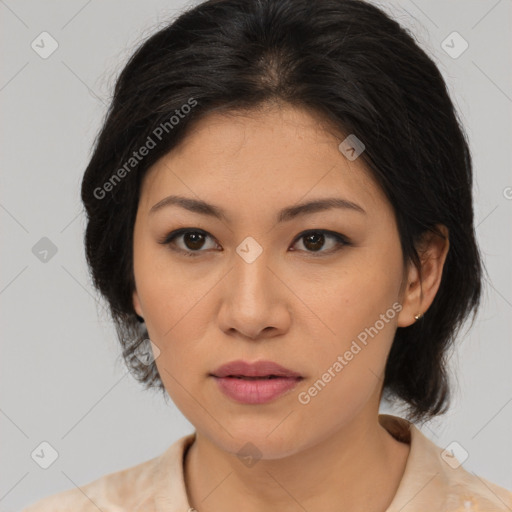 Joyful asian young-adult female with medium  brown hair and brown eyes