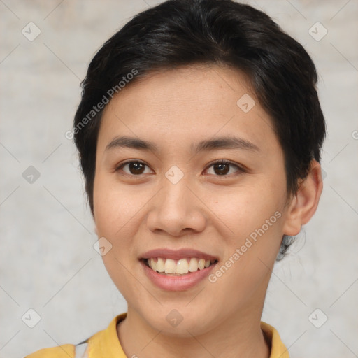 Joyful asian young-adult female with short  brown hair and brown eyes