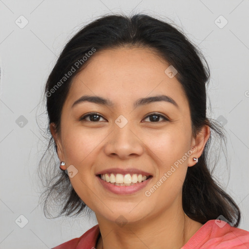 Joyful latino young-adult female with medium  brown hair and brown eyes