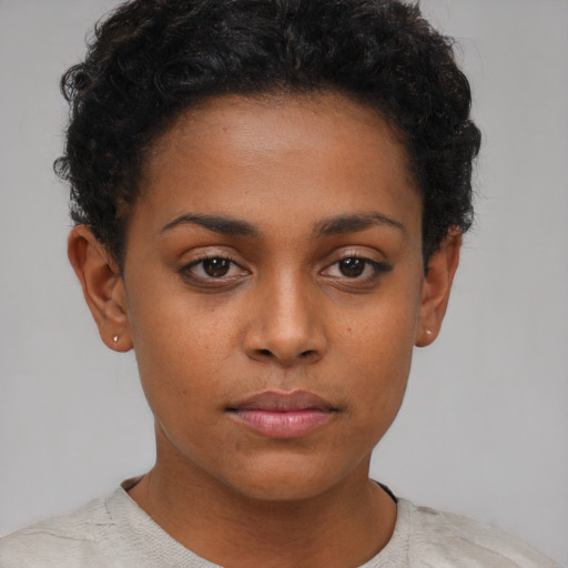 Neutral black young-adult female with short  brown hair and brown eyes