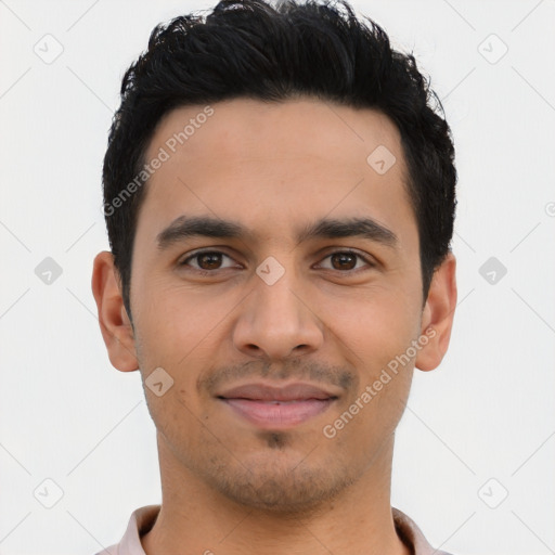 Joyful latino young-adult male with short  black hair and brown eyes