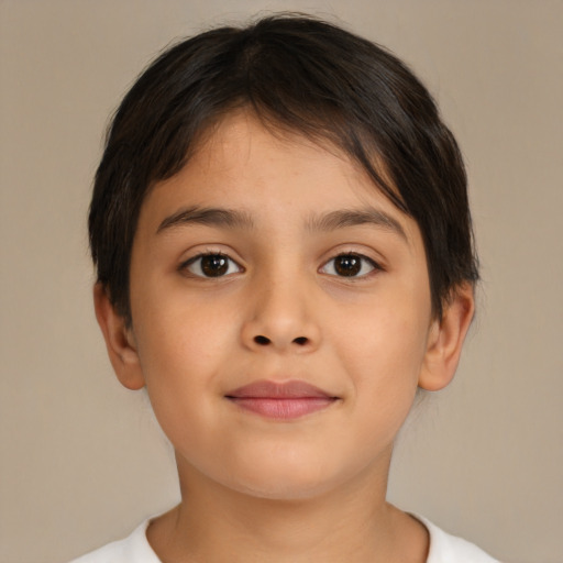 Joyful white child female with short  brown hair and brown eyes