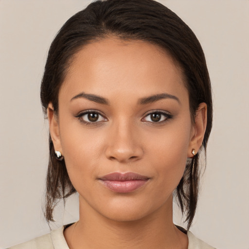 Joyful white young-adult female with medium  brown hair and brown eyes