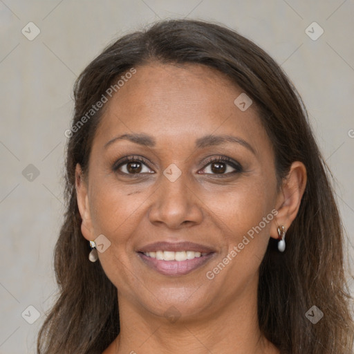 Joyful black adult female with long  brown hair and brown eyes