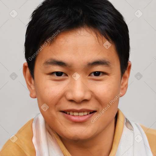 Joyful asian young-adult male with short  brown hair and brown eyes