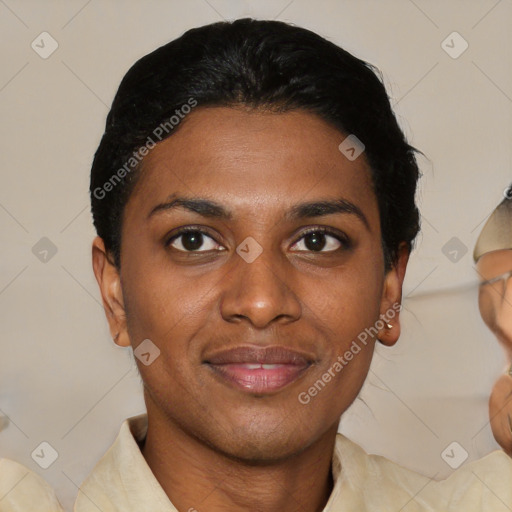 Joyful black young-adult female with short  black hair and brown eyes