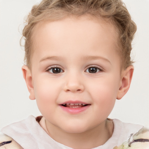 Joyful white child female with short  brown hair and brown eyes