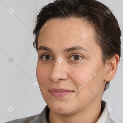 Joyful white adult female with short  brown hair and brown eyes