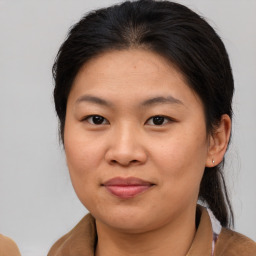 Joyful asian young-adult female with medium  brown hair and brown eyes