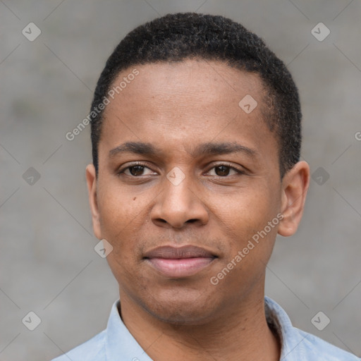 Joyful black young-adult male with short  black hair and brown eyes