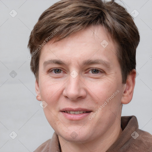 Joyful white adult male with short  brown hair and grey eyes