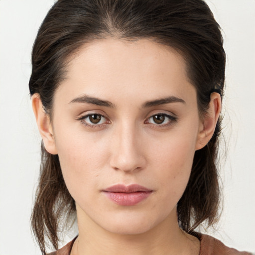 Neutral white young-adult female with medium  brown hair and brown eyes