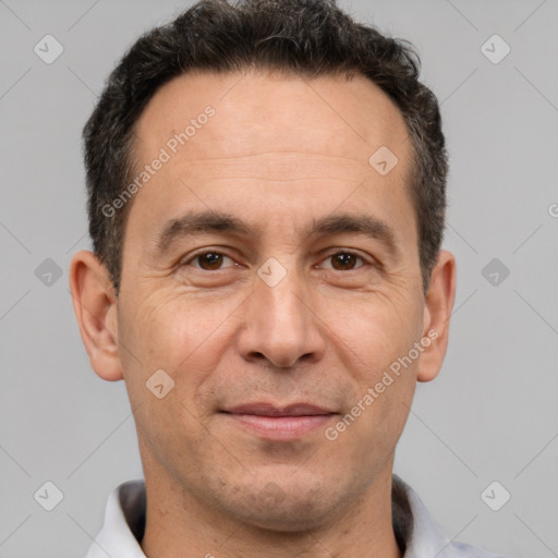 Joyful white adult male with short  brown hair and brown eyes