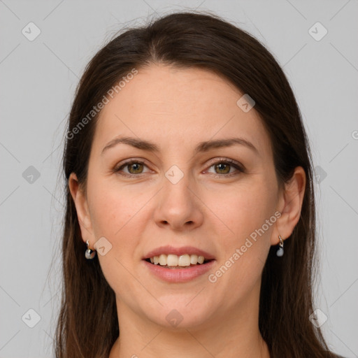 Joyful white young-adult female with long  brown hair and green eyes