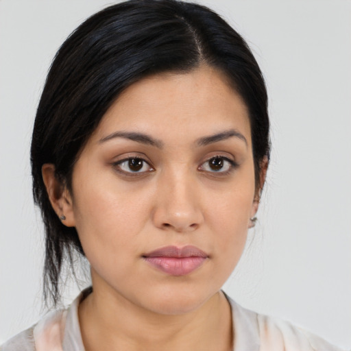 Joyful latino young-adult female with medium  black hair and brown eyes