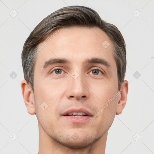 Neutral white young-adult male with short  brown hair and brown eyes