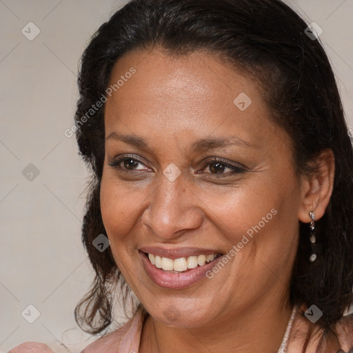 Joyful black adult female with medium  brown hair and brown eyes