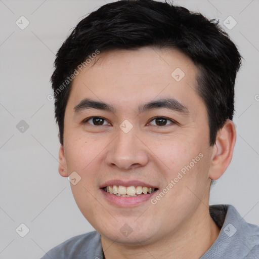 Joyful white young-adult male with short  black hair and brown eyes