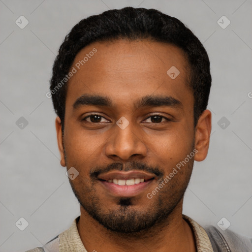 Joyful black young-adult male with short  black hair and brown eyes