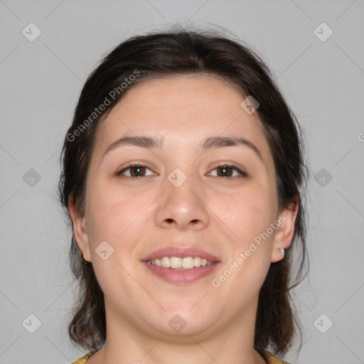 Joyful white adult female with medium  brown hair and brown eyes