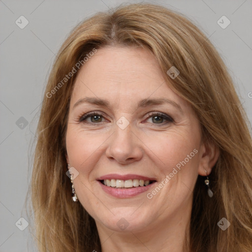 Joyful white adult female with long  brown hair and brown eyes