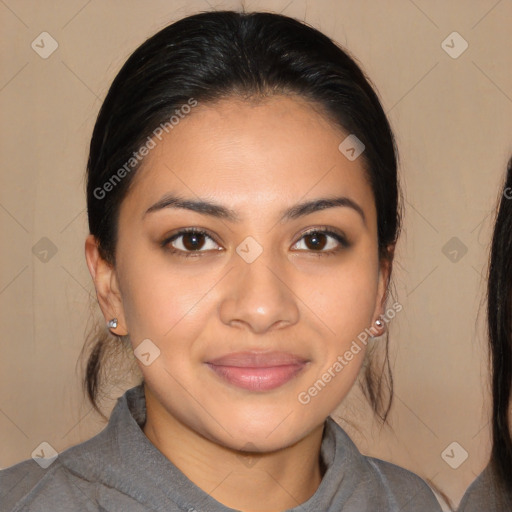 Joyful latino young-adult female with medium  brown hair and brown eyes