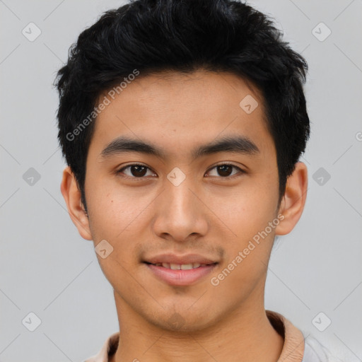 Joyful asian young-adult male with short  black hair and brown eyes