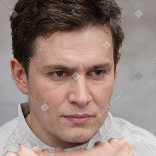 Joyful white adult male with short  brown hair and grey eyes