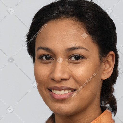 Joyful latino young-adult female with medium  brown hair and brown eyes