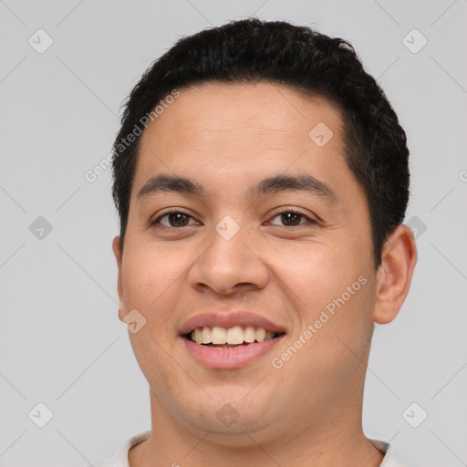 Joyful asian young-adult male with short  brown hair and brown eyes