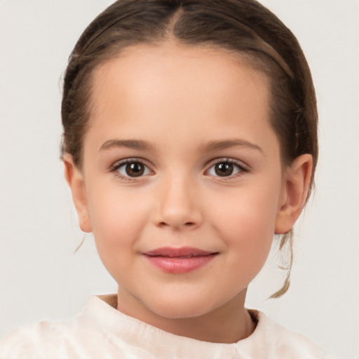 Joyful white child female with short  brown hair and brown eyes