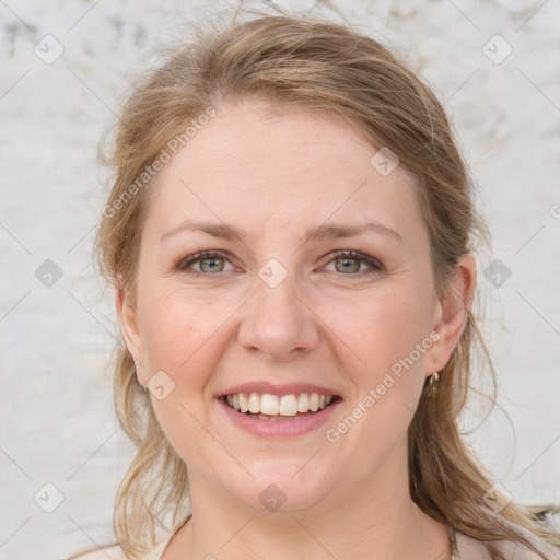 Joyful white young-adult female with medium  brown hair and blue eyes