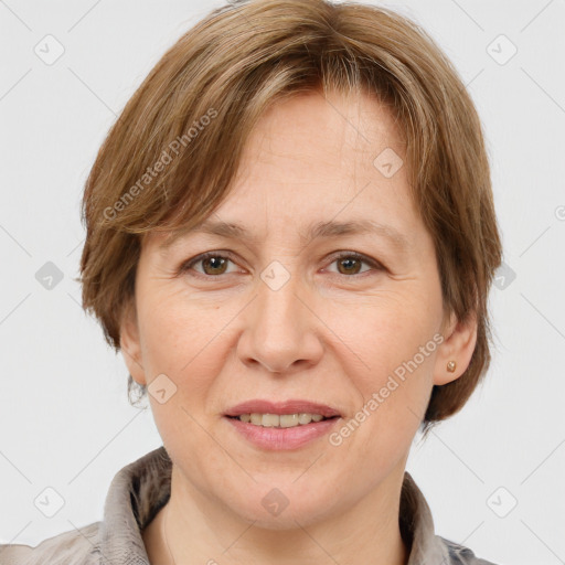 Joyful white adult female with medium  brown hair and grey eyes