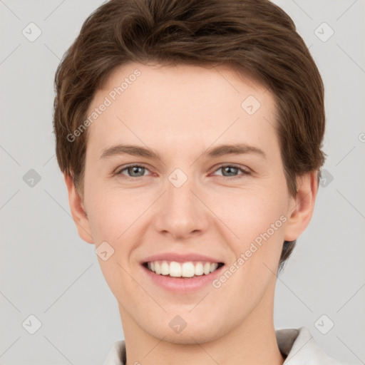 Joyful white young-adult female with short  brown hair and grey eyes