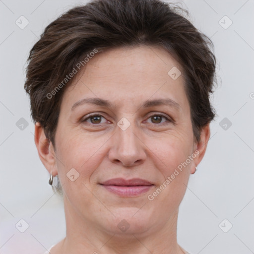 Joyful white adult female with short  brown hair and brown eyes